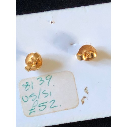 50 - Pair of 9ct gold ear studs