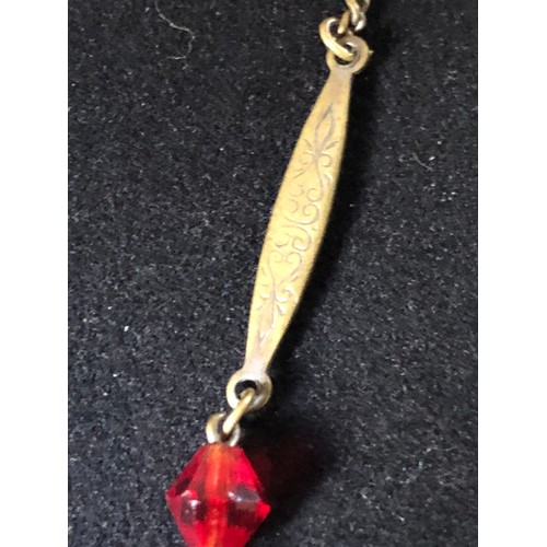 61 - 1920's Edwardian silver plated chain with a bright vermilion red crystal paste briolette suspended f... 