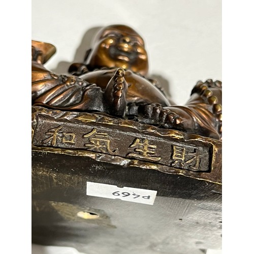 139 - Bronze Buddha with bat detail and character marks