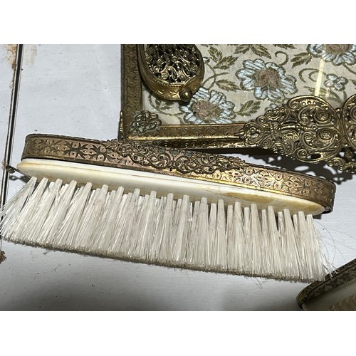 142 - Embroided antique gilt floral ladies brush set.