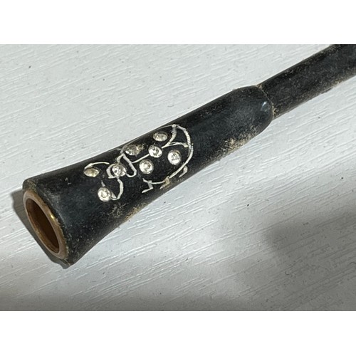 144 - 1920,s cigarette holder with beetle design and diamante set in Bakelite.