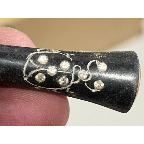 144 - 1920,s cigarette holder with beetle design and diamante set in Bakelite.