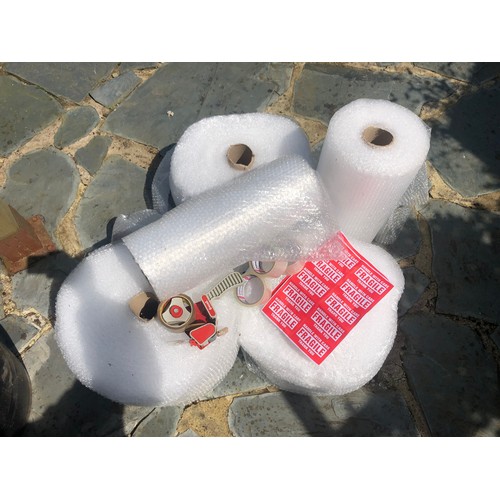 174 - Quantity of bubble wrap with tape gun plus 3 rolls and fragile stickers