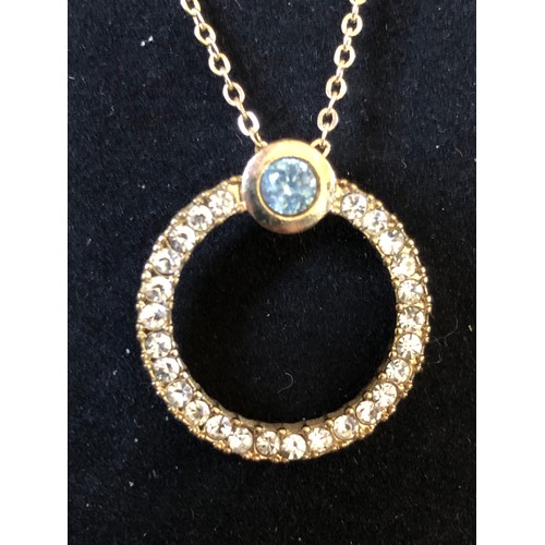 196 - Gold plated necklace with circular jewelled pendant