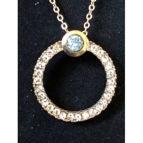 196 - Gold plated necklace with circular jewelled pendant