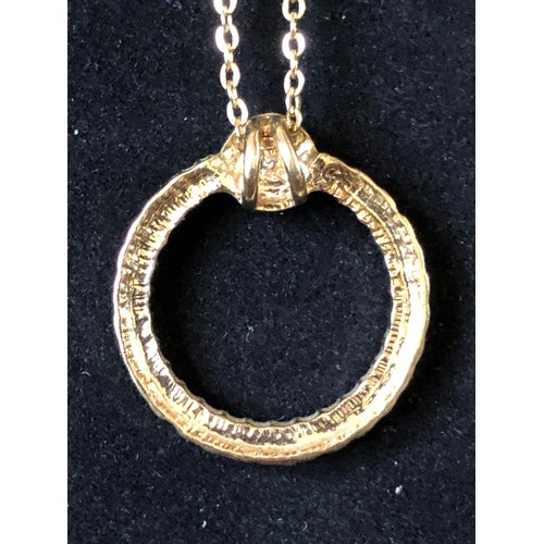 196 - Gold plated necklace with circular jewelled pendant