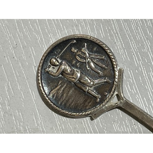 199 - Solid silver teaspoon. RB Birmingham Lion N date letter. With golfing scene.