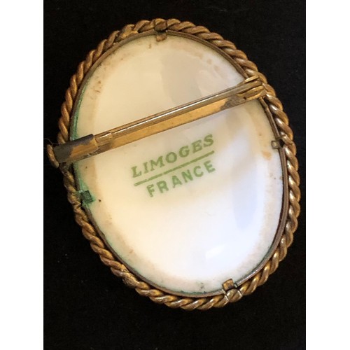 39 - Pretty Limoges France convex hand painted porcelain brooch set in a ropework gold plated frame with ... 