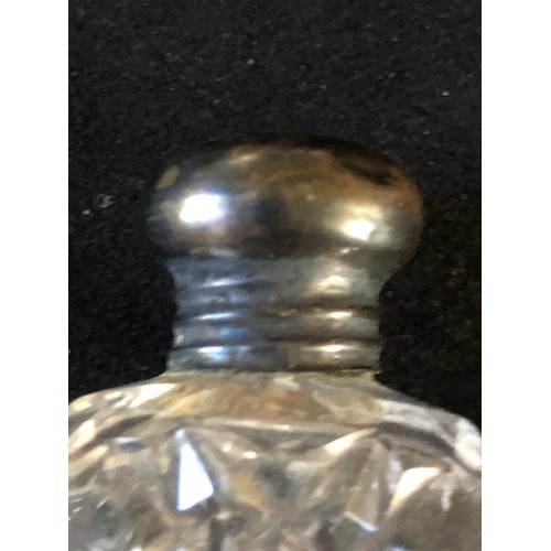 44 - Silver toppeed perfume bottle in cut crystal glass. Hobnail pattern possibly Harvard pattern by Bacc... 