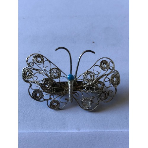 63 - Pretty silver coloured filigree butterfly brooch
