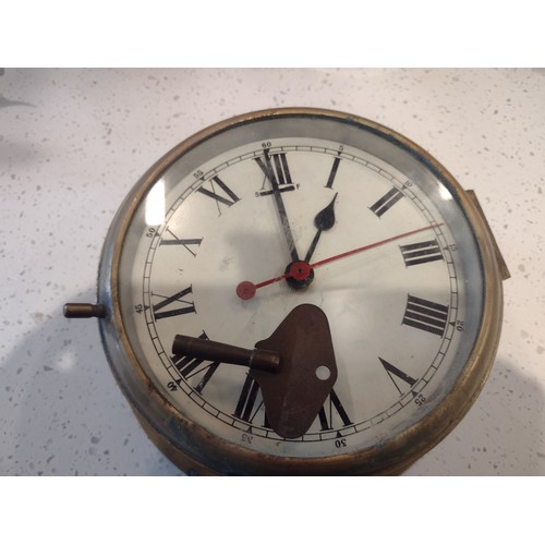 87 - Ships clock in good working order complete with key