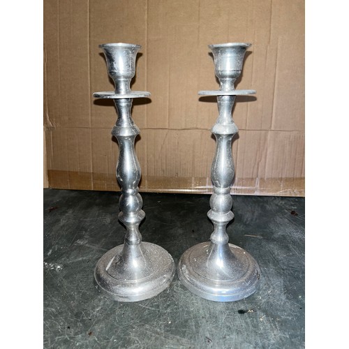 116 - Pair of aluminium candlesticks,