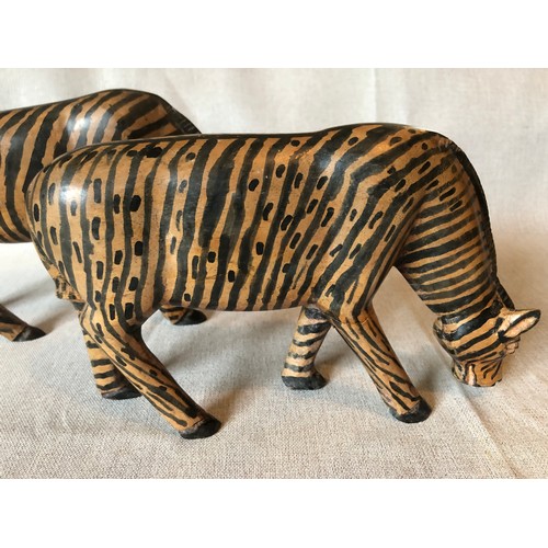 159 - A pair of hand carved wooden trbal art Zebras