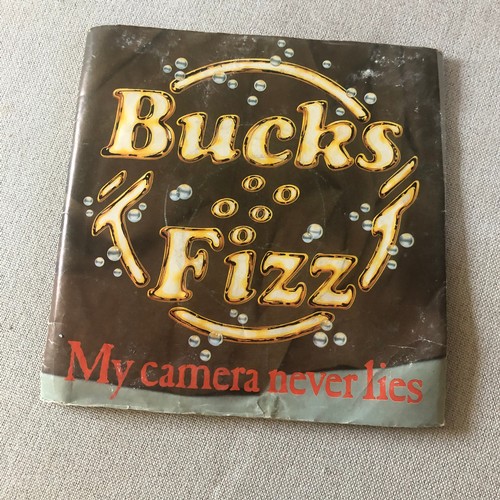 99 - Books fizz poster. My camera never lies . Used with remnants of Blu-Tack