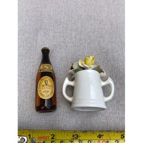 21 - Miniature Guinness bottle Staffordshire cup containing flowers