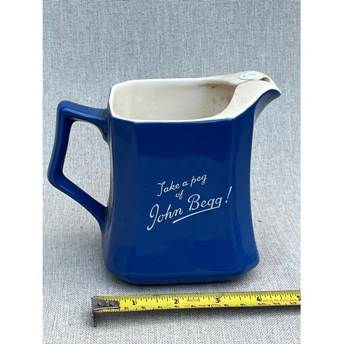 113 - John Begg scotch whisky jug by Wade