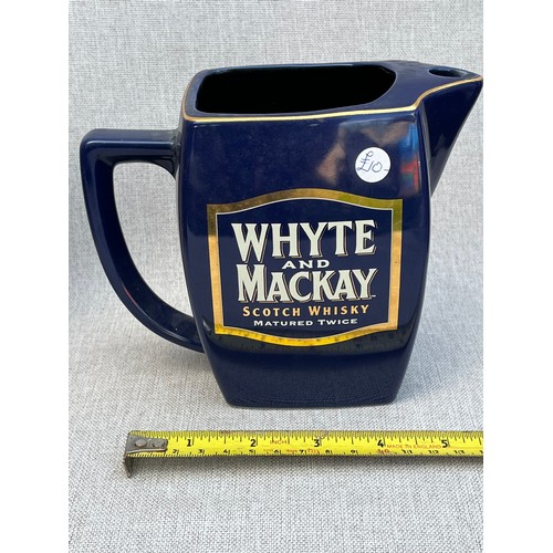 171 - Whyte and MacKay Scotch Whisky matured Twice Jug. Repaired handle. Marked J10 under