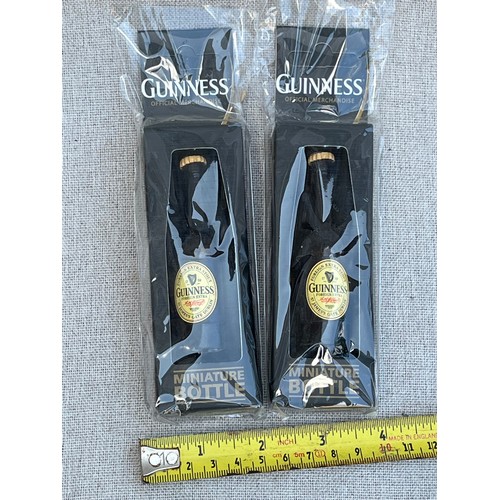 173 - 2 x Miniature Guinness bottles in boxes and packaging