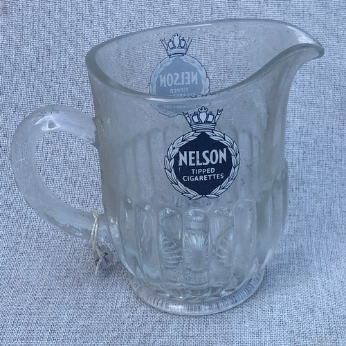 199 - Nelson tipped cigarettes glass jug.