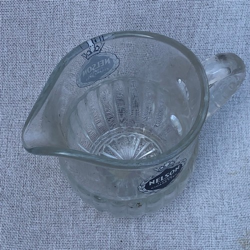 199 - Nelson tipped cigarettes glass jug.