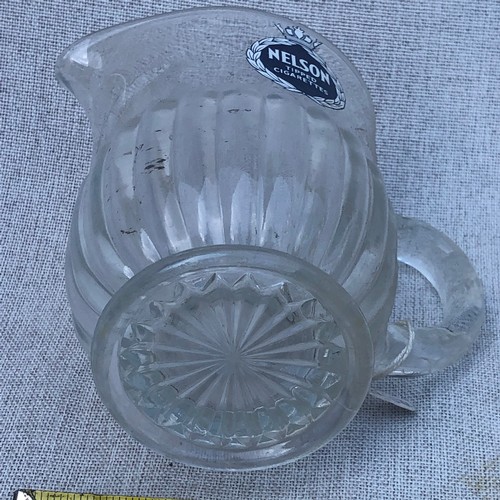 199 - Nelson tipped cigarettes glass jug.