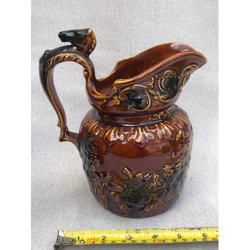 226 - Arthur Woods John Gilpin Horse Head Pitcher treacle glazed relief pattern jug with horse head handle... 