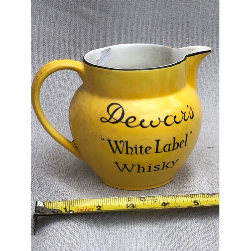 234 - Dewar’s White label whisky jug by John Maddox & Sons.