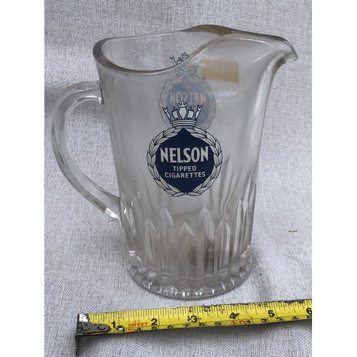 244 - Nelson tipped cigarettes Glass jug