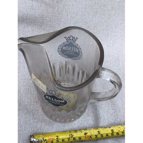 244 - Nelson tipped cigarettes Glass jug