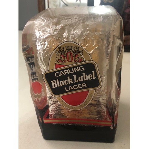 297 - Carling Black Label pump cover in plastic