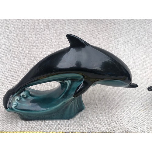 323 - Pair of small dolphins on waves by Poole pottery