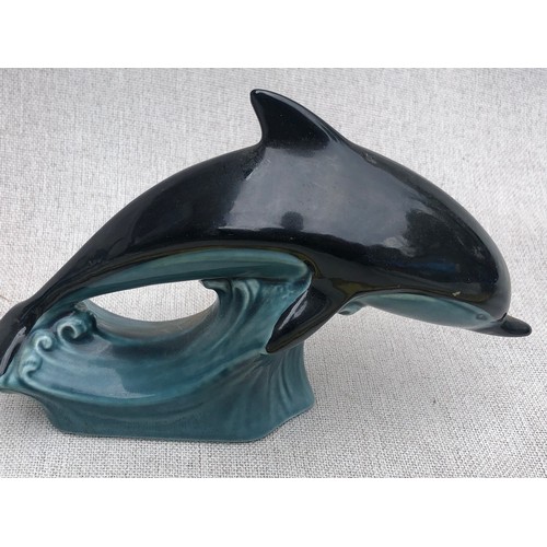 323 - Pair of small dolphins on waves by Poole pottery