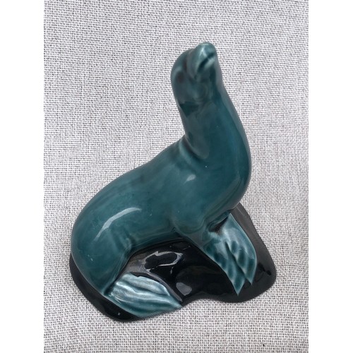 324 - Poole pottery otter with fish and seal on rock