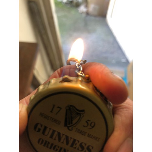 310 - Vintage Guinness key fob gas lighter.  works