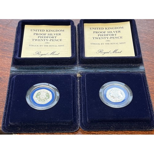 699 - Two boxed silver proof 20p coins, 1982, boxed with certificates