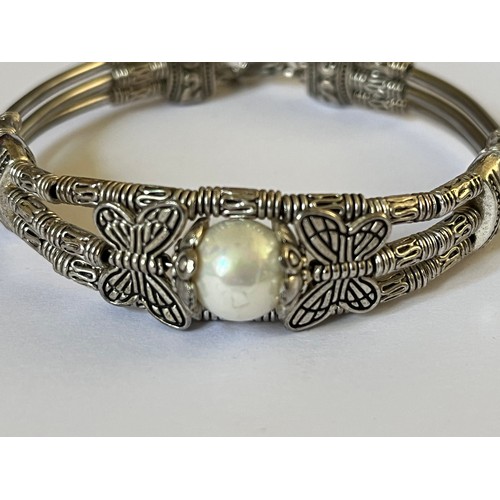 28 - Tibetan White Metal & White Pearl Bracelet. Detailing tests as low grade silver.