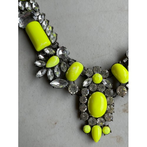 36 - Chunky yellow and rhinestone on white metal necklace.