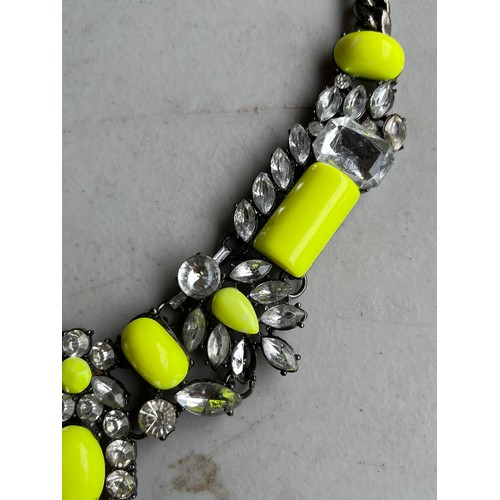 36 - Chunky yellow and rhinestone on white metal necklace.