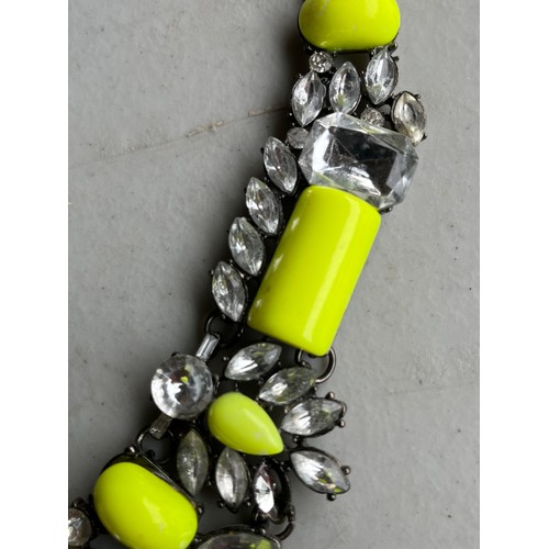 36 - Chunky yellow and rhinestone on white metal necklace.