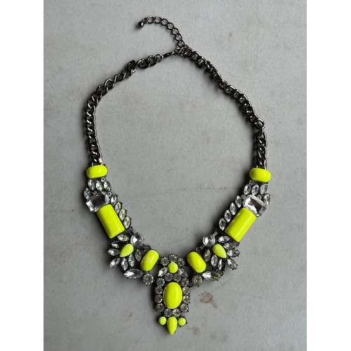 82 - Chunky yellow and rhinestone on white metal necklace.