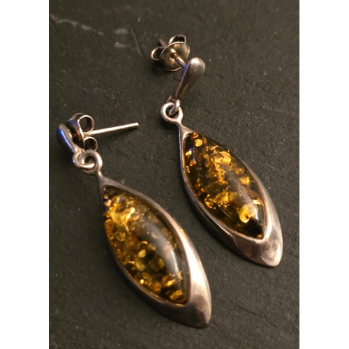 104 - Silver and green Amber earrings.