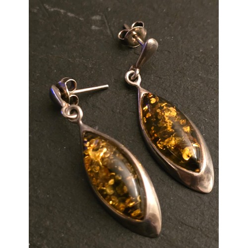 104 - Silver and green Amber earrings.