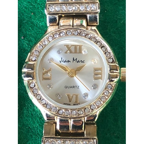 125 - Jean Marc quartz watch in gold plate and bling.