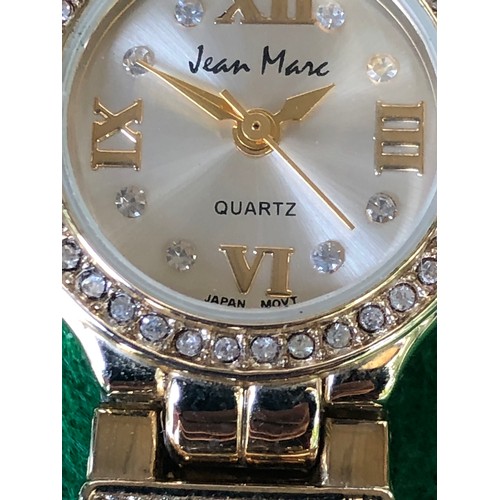 125 - Jean Marc quartz watch in gold plate and bling.