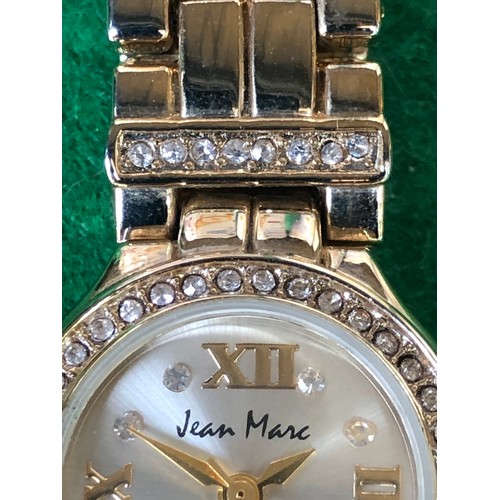 125 - Jean Marc quartz watch in gold plate and bling.