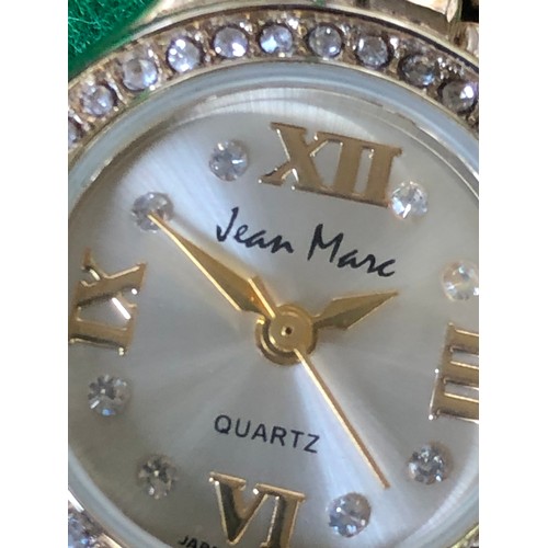 125 - Jean Marc quartz watch in gold plate and bling.