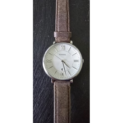 127 - Full working order..Fossil watch, leather strap.