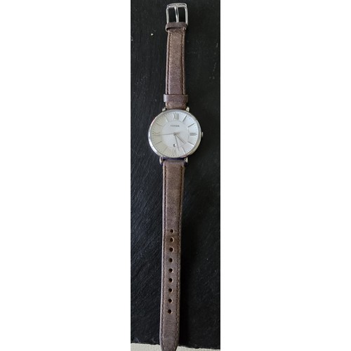 127 - Full working order..Fossil watch, leather strap.