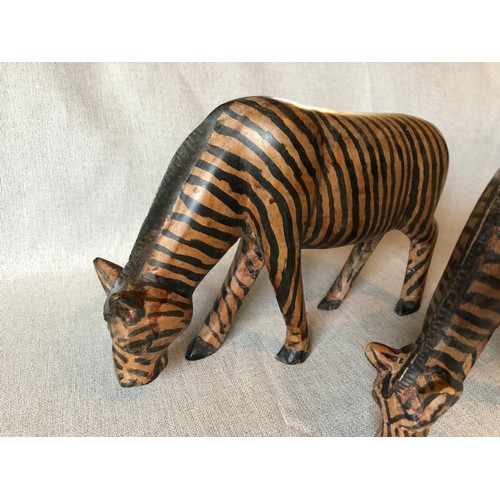 178 - A pair of hand carved wooden trbal art Zebras