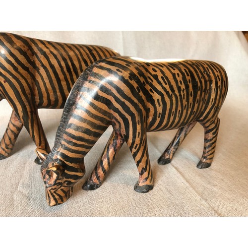 178 - A pair of hand carved wooden trbal art Zebras